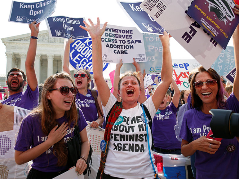 Demonstrators celebrate at the U.S. Supreme Court after the court struck down a Texas law imposing strict regulations on abortion doctors and facilities that its critics contended were specifically designed to shut down clinics in Washington on June 27, 2016. REUTERS/Kevin Lamarque
*Editors: This photo may only be republished with RNS-SCOTUS-ABORTION, originally transmitted on June 27, 2016.