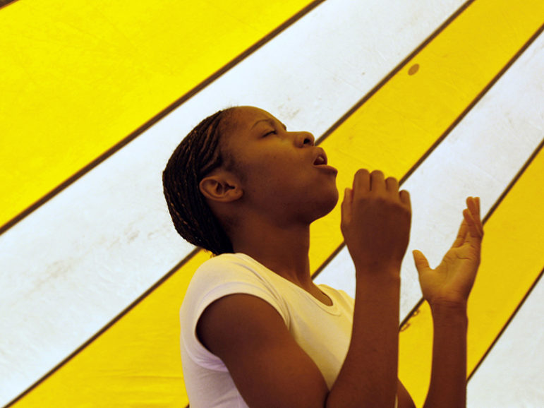 Shavon Gardner, 17, prays as she sings with the Redeemed Christian Church of God youth choir at Redemption Camp in Floyd, Texas, on June 17, 2009. Photo courtesy of REUTERS/Jessica Rinaldi
*Editors: This photo may only be republished with RNS-UNCHURCHED-SURVEY, originally transmitted on June 28, 2016.