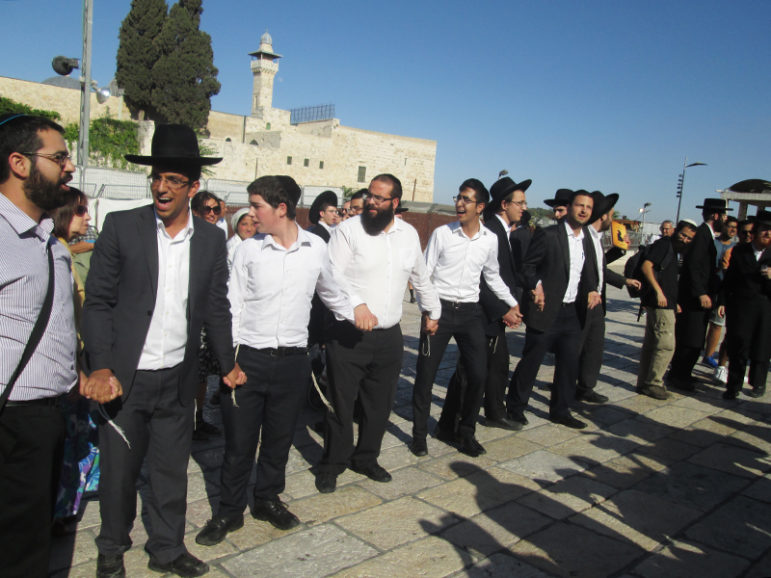 Despite a strong police presence the police did not intervene when dozens of ultra-Orthodox men tried to disrupt government-sanctioned Reform and Conservative prayers in the Western Wall's public plaza. RNS photo by Michele Chabin