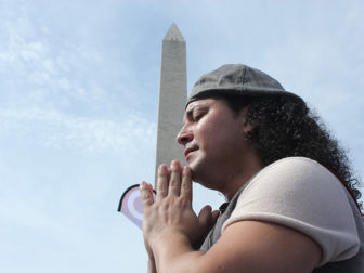 Christian prays at evangelical rally