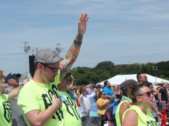 Evangelical Christian prays at rally
