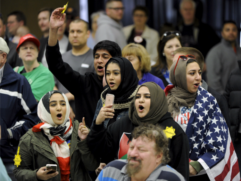 Young Muslims protest  Republican presidential candidate Donald Trump before being escorted out during a campaign rally in the Kansas Republican Caucus at the Century II Convention and Entertainment Center on March 5, 2016, in Wichita, Kan. Dave Kaup/REUTERS