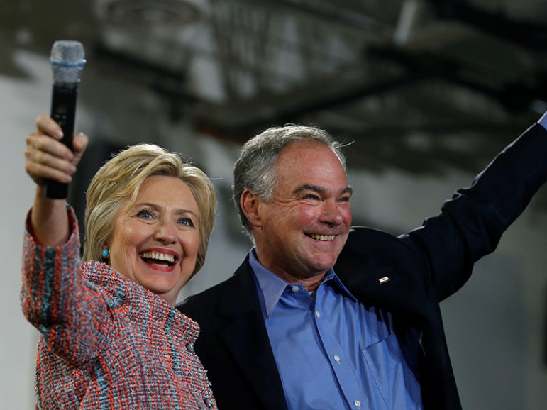 Democratic presidential candidate Hillary Clinton and U.S. Sen. Tim Kaine, D-Va., wave to the crowd during a campaign rally at Ernst Community Cultural Center in Annandale, Va., on July 14, 2016.  Courtesy of REUTERS/Carlos Barria