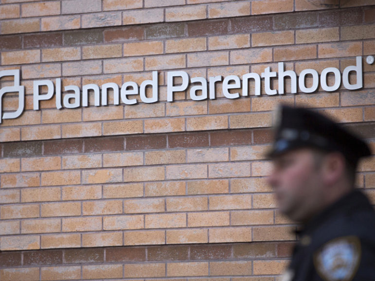 A member of the New York Police Department stands outside a Planned Parenthood clinic in the Manhattan borough of New York, on Nov. 28, 2015. Photo courtesy of REUTERS/Andrew Kelly
*Editors: This photo may only be republished with RNS-GOLDBERG-COLUMN, originally transmitted on Dec. 2, 2015.