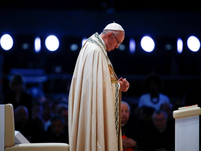 Pope Francis prays during a prayer vigil with youth at the Campus Misericordiae during World Youth Day in Brzegi, near Krakow, Poland, on July 30, 2016. Photo courtesy Reuters/Stefano Rellandini     