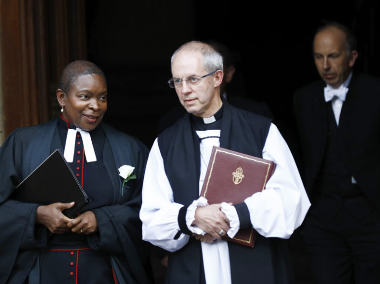 Archbishop of Canterbury Justin Welby chats with a fellow member of the clergy as they walk from Parliament to St. Margaret’s Church for a service of remembrance on June 20, 2016 for British lawmaker Jo Cox, who was shot and stabbed to death June 16 in London.  Photo courtesy REUTERS/Stefan Warmth