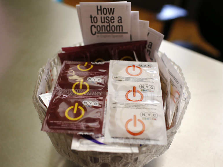 A bowl of free condoms is seen in a lobby at the AIDS Service Center of New York City's Lower Manhattan headquarters on July 3, 2012. Photo courtesy of REUTERS/Mike Segar