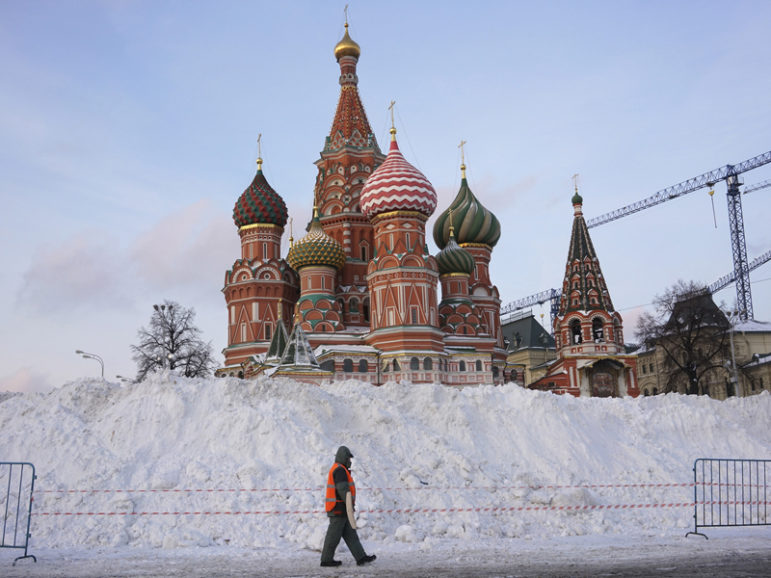 A street sweeper walks past St. Basil's Cathedral at Red Square in Moscow on Jan. 15, 2016. Photo courtesy of REUTERS/Maxim Zmeyev