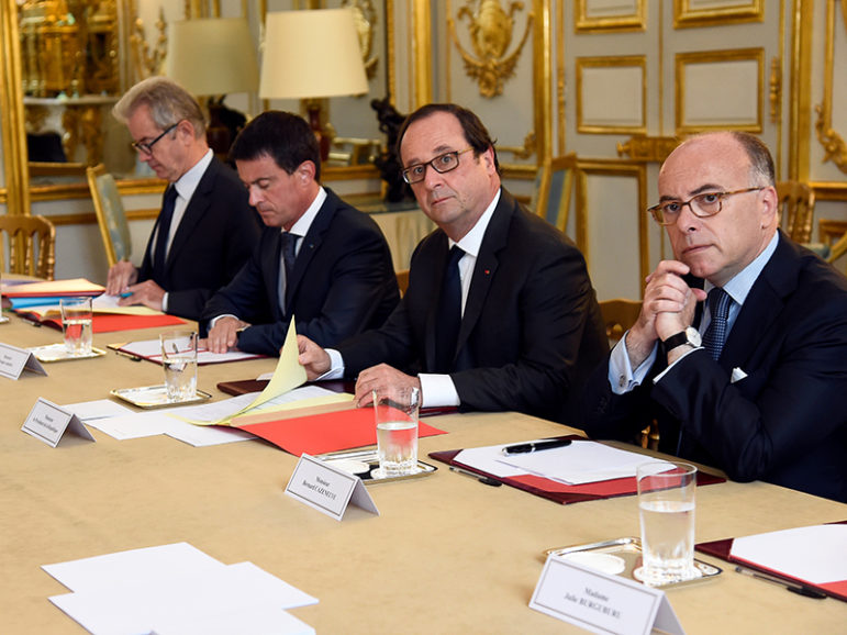 French Prime Minister Manuel Valls, second from left; President Francois Hollande, third from left; and Interior Minister Bernard Cazeneuve, right,  look on during a meeting with French representatives of religious communities at the Elysee Palace in Paris on July 27, 2016. Photo courtesy of REUTERS/Bertrand Guay/Pool 
*Editors: This photo may only be republished with RNS-FRANCE-TERROR, originally transmitted on July 27, 2016.
