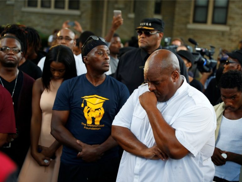 Community members attend a vigil Aug. 14, 2016, after disturbances following the police shooting of a man in Milwaukee. Photo by Aaron P. Bernstein/REUTERS