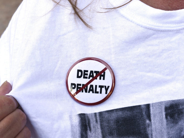 An anti-death penalty button is worn by a demonstrator attending a protest against the scheduled execution of convicted murderer Richard Glossip, at the state capitol in Oklahoma City, Oklahoma on September 15, 2015. Photo courtesy of REUTERS/Nick Oxford