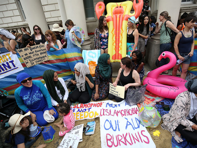 Protesters demonstrate against France's ban of the burkini, outside the French Embassy in London, Britain on August 25, 2016. Photo courtesy of REUTERS/Neil Hall.
