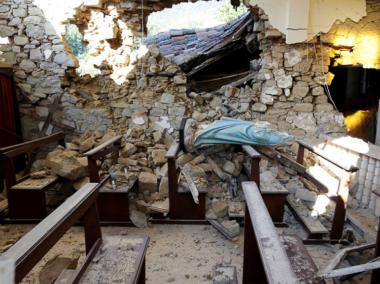 A damaged Virgin Mary statue is seen in a church following an earthquake at Cossito near Amatrice in central Italy, on August 26, 2016. Photo courtesy of REUTERS/Max Rossi