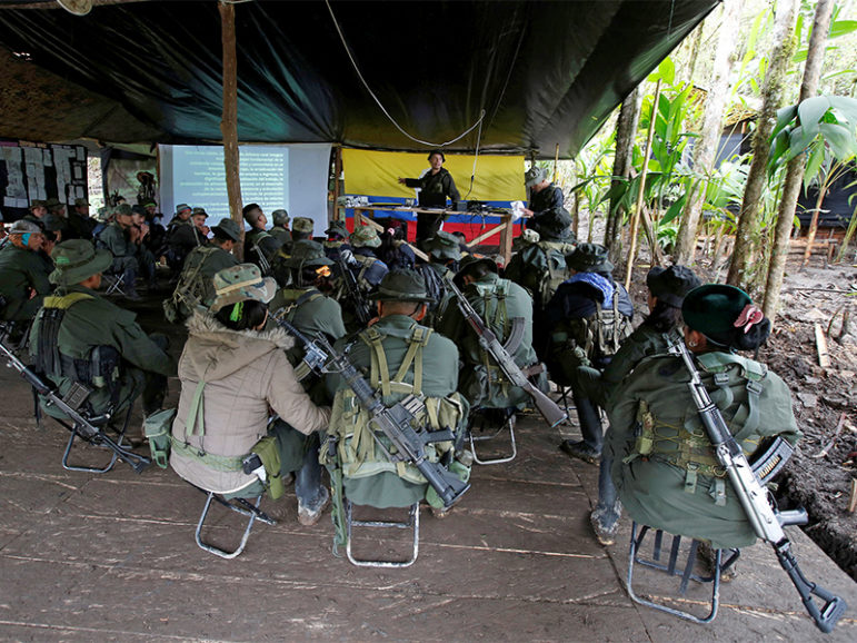 Members of the 51st Front of the Revolutionary Armed Forces of Colombia (FARC) listen to a lecture on the peace process between the Colombian government and their force at a camp in Cordillera Oriental, Colombia, on August 16, 2016. Photo courtesy of REUTERS/John Vizcaino *Editors: This photo may only be republished with RNS-POPE-COLOMBIA, originally transmitted on August 31, 2016.