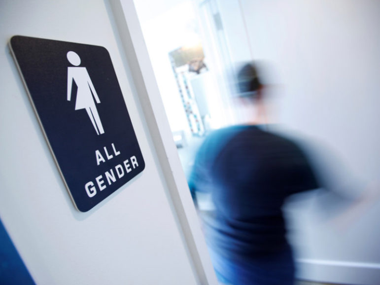 A bathroom sign welcomes both genders at the Cacao Cinnamon coffee shop in Durham, North Carolina on May 3, 2016. Photo courtesy of REUTERS/Jonathan Drake/File Photo *Editors: This photo may only be republished with RNS-GUTHRIE-SATIRE, originally transmitted on May 11, 2016.