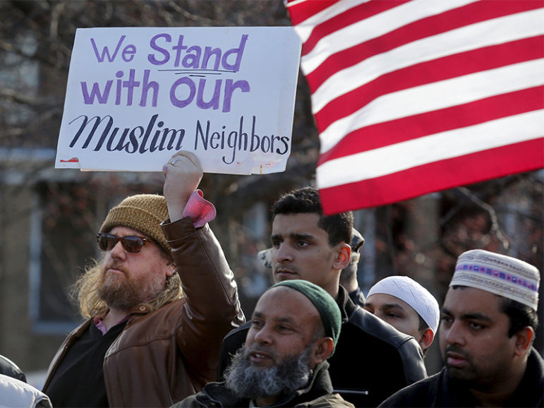Frank Woodman holds a sign in support of his Muslim neighbors as he joins Bangladeshi- and Yemeni-Americans to protest against the Islamic State group and political and religious extremism during a rally in the Detroit suburb of Hamtramck, Mich., on Dec. 11, 2015. Photo courtesy of REUTERS/Rebecca Cook
*Editors: This photo may only be republished with RNS-ISLAMAPHOBIA-OPED, originally transmitted on Sept. 7, 2016.