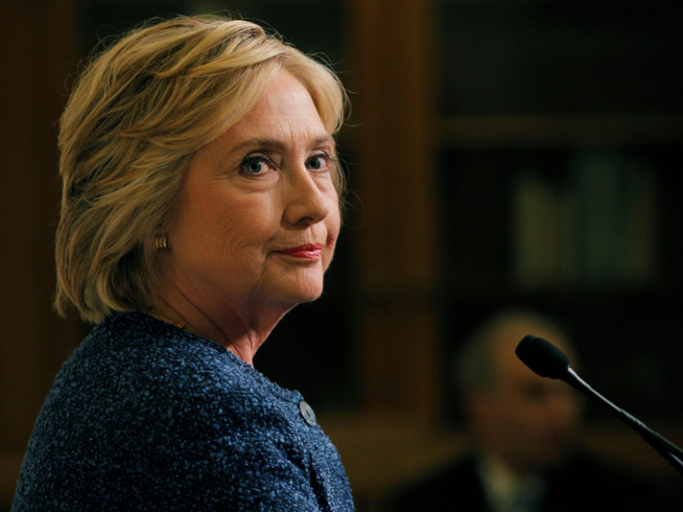 Democratic presidential candidate Hillary Clinton speaks to reporters after holding a 