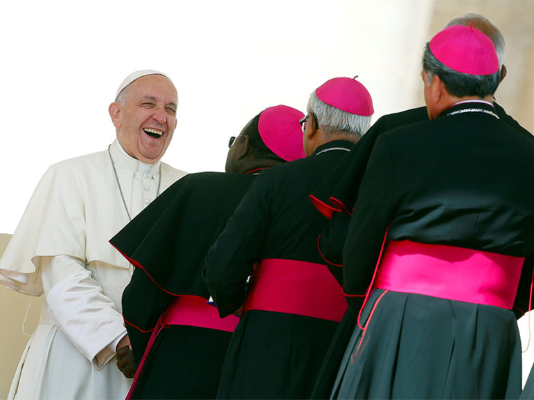 Pope Francis smiles as he greets bishops at the end of his Wednesday general audience in Saint Peter's square at the Vatican on September 7, 2016. Photo courtesy of REUTERS/Remo Casilli
*Editors: This photo may only be republished with RNS-POPE-BISHOPS, originally transmitted on September 16, 2016.
