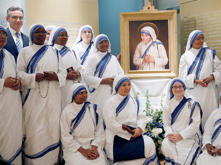 Members of Mother Teresa's order, the Missionaries of Charity, and artist Chas Fagan, gather after the unveiling of an official canonization portrait of Mother Teresa at the John Paul II National Shrine in Washington, on September 1, 2016. Photo courtesy of REUTERS/Gary Cameron
*Editors: This photo may only be republished with RNS-MOTHER-TERESA, originally transmitted on Sept. 2, 2016.