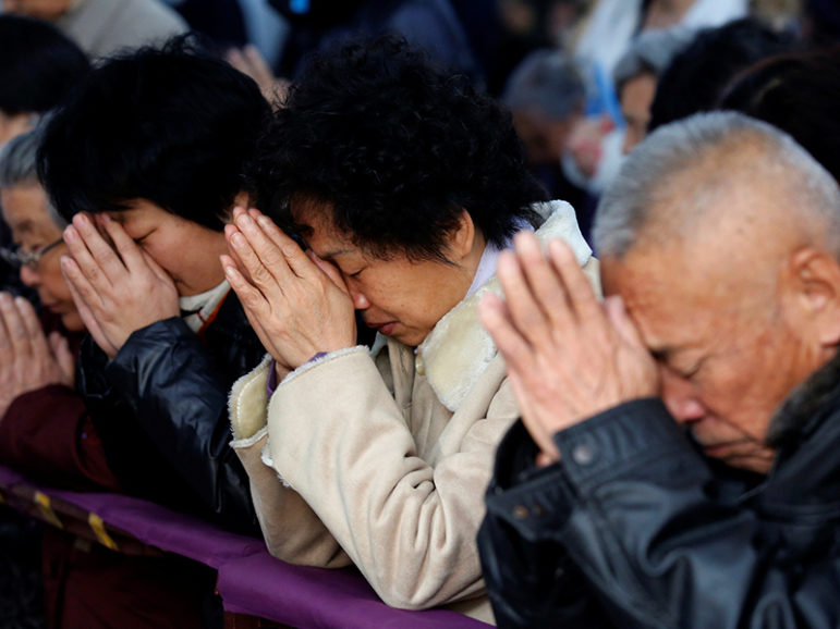 Believers take part in a weekend mass at an underground Catholic church in Tianjin November 10, 2013. Courtesy of REUTERS/Kim Kyung-Hoon