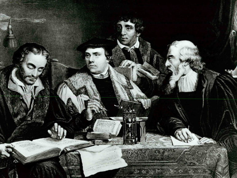 Reformer Martin Luther (center) works closely with several colleagues in translating the German-language edition of the Bible. The edition appeared in 1532, 15 years after Luther's challenge to the practice of selling indulgences led to the Protestant Reformation. At right are Johann Bugenhagen (standing), a pastor, and Caspar Cruciger, who edited many of Luther's writings. Engraving by J.C. Buttre. Religion News Service file photo