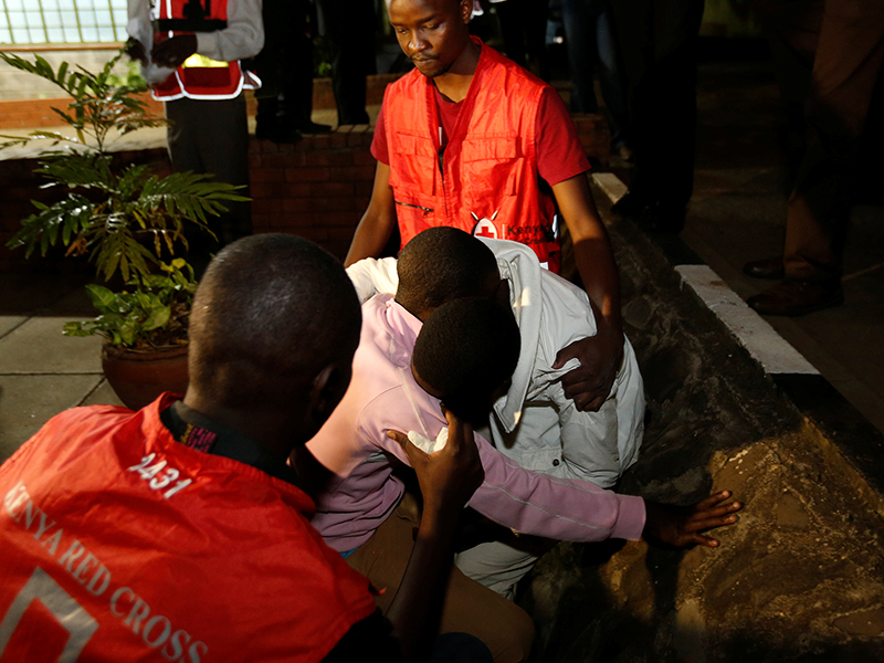Kenya Red Cross staff console relatives of the civilians killed following an attack at the Bisharo lodging by Islamist militants from the Somali group al Shabaab in Mandera, at the Chiromo mortuary in Kenya's capital Nairobi, on October 25, 2016. Photo courtesy of Reuters/Thomas Mukoya *Editors: This photo may only be republished with ALSHABAB-KENYA, originally transmitted on Oct. 26, 2016.