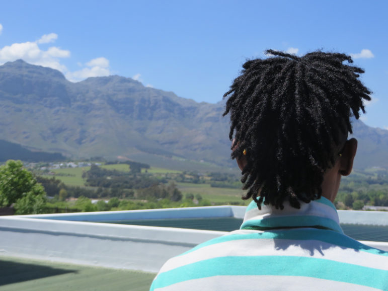 Mr. Abdullah, who did not wish to be identified, looks out at the view of the Western Cape’s mountains and vineyards during The Inner Circle’s seven-day Annual International Retreat in South Africa. RNS photo by Brian Pellot
