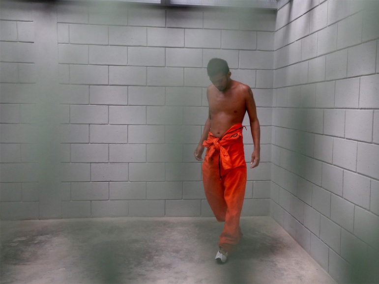 A prisoner walks into his cell in the new high-security prison known as 