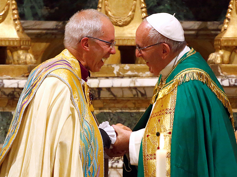 Pope Francis smiles with Archbishop of Canterbury Justin Welby at the end of vespers prayers at the monastery church of San Gregorio al Celio in Rome, on October 5, 2016. Photo courtesy of Reuters/Tony Gentile