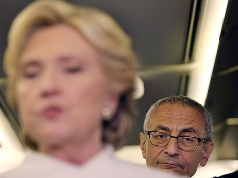 John Podesta, chairman of U.S. Democrat Hillary Clinton's presidential campaign, listens as she talks to the media inside of her campaign plane after the third and final 2016 presidential campaign debate in North Las Vegas, Nevada, on October 19, 2016. Photo courtesy of REUTERS/Carlos Barria.
*Editors: This photo may only be republished with RNS-CAFARDI-OPED, originally transmitted on Oct. 28, 2016.
