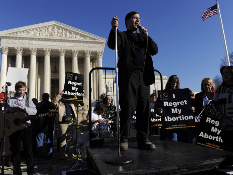 Rev. Frank Pavone, National Director of Priests for Life, leads a prayer during the March for Life anti-abortion rally in front of the US Supreme Court building in Washington, on January 22, 2009. Photo courtesy of REUTERS/Jonathan Ernst
