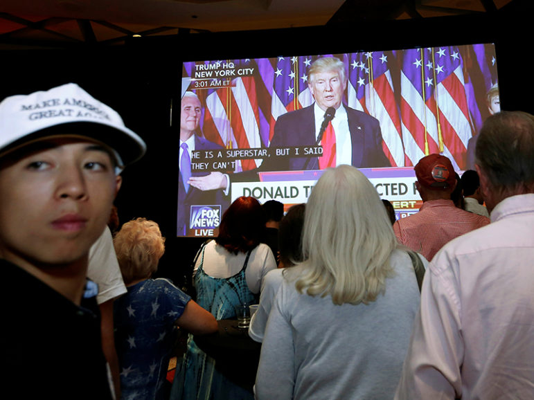 Donald Trump supporters in Phoenix watch the president-elect give his victory speech early on Nov. 9, 2016. Photo courtesy of Reuters/Nancy Wiechec
*Editors: This photo may only be republished with RNS-ESTHER-OPED, originally transmitted on Nov. 17, 2016.