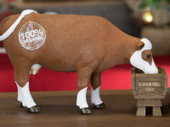 The cow, stamped with “100% Organic,” eats gluten free feed in the Hipster Nativity set. Photo courtesy of Modern Nativity