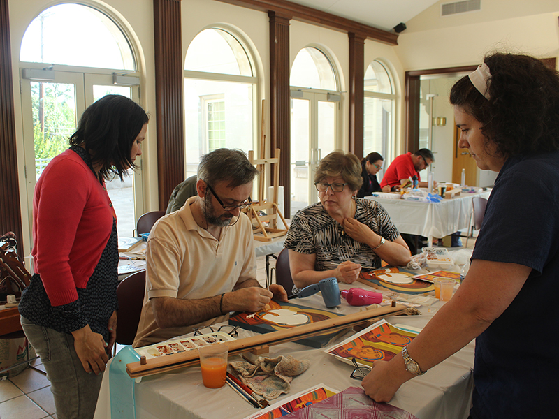 Iconographer Theodoros Papadopoulos works with students in his iconography class at St. Sophia Greek Orthodox Cathedral in Washington, D.C., in June 2016. From left to right are Lara Neri of Dallas; Paula Magoulas of Washington, D.C.; and Helen Rainey of Washington, D.C. RNS photo by Adelle M. Banks