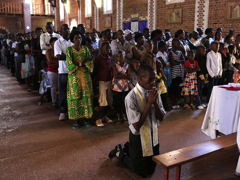 A worshipper kneels down during a service at the Saint-Famille Catholic Church a day ahead of the commemoration of the 20th anniversary of the genocide in the Rwandan capital, Kigali, on April 6, 2014. An estimated 800,000 people were killed in 100 days during the genocide. Photo courtesy of Reuters/Noor Khamis
*Editors: This photo may only be republished with RNS-KIGALI-BISHOPS, originally transmitted on Nov. 21, 2016.