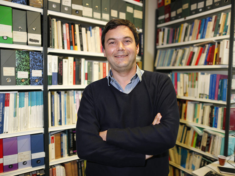 French economist and academic Thomas Piketty poses on May 12, 2014, in his book-lined office at the French School for Advanced Studies in the Social Sciences, in Paris. Photo courtesy of Reuters/Charles Platiau
*Editors: This photo may only be republished with RNS-NASSER-OPED, originally transmitted on Nov. 22, 2016.