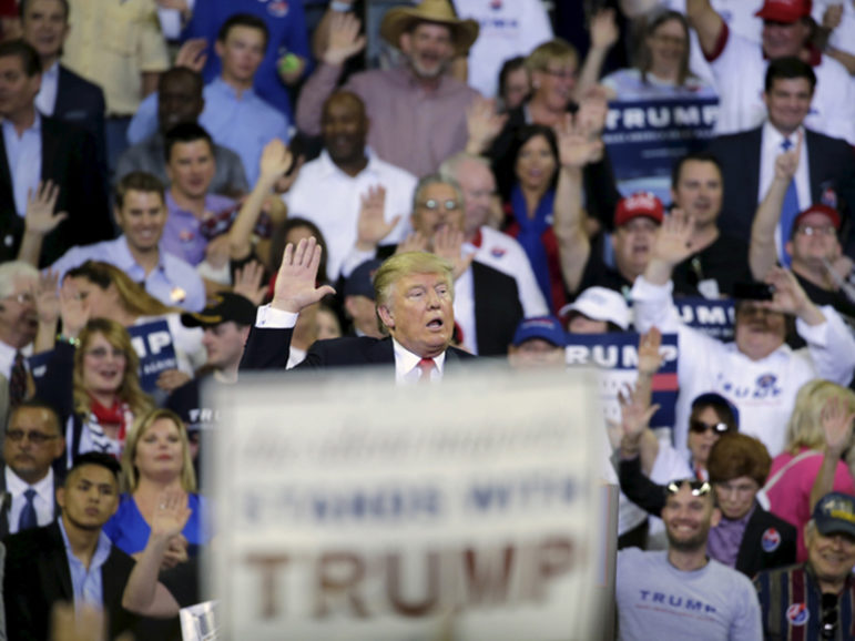 Republican U.S. presidential candidate Donald Trump asks his supporters to raise their hands and promise to vote for him at his campaign rally at the University of Central Florida in Orlando, Fla., on March 5, 2016. Photo courtesy of REUTERS/Kevin Kolczynski