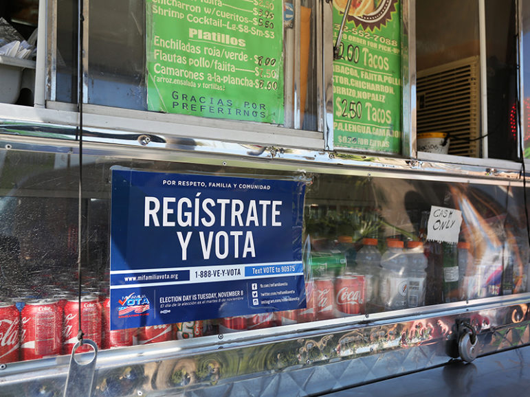 A voter registration sign is seen Sept. 29, 2016, on a taco truck in Houston as part of the U.S. Hispanic Chamber of Commerce's 