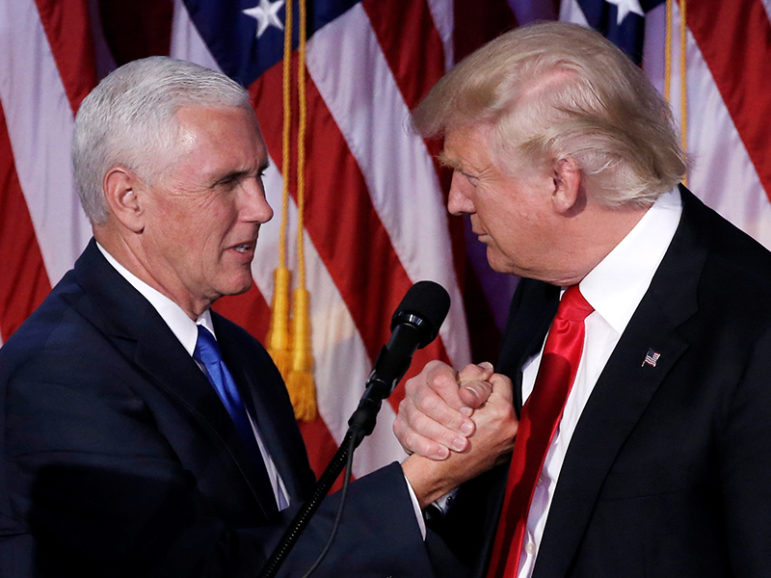 President-elect Donald Trump, right, and Vice President-elect Mike Pence clasp hands at their post-election rally in New York City on Nov. 9, 2016. Photo courtesy of Reuters/Mike Segar