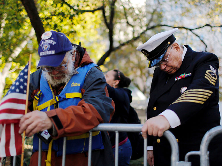 U.S. war veterans and military members pay their respects during a minute of silence while they attend a ceremony during the Veterans Day parade in New York City on Nov. 11, 2016.  Photo courtesy of REUTERS/Eduardo Munoz