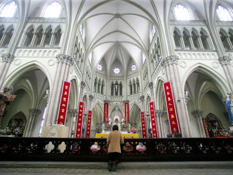 A Chinese Catholic prays on Easter Sunday at the state-sanctioned Saint Ignatius Cathedral in Shanghai March 27, 2005. File photo by Claro Cortes IV/REUTERS
