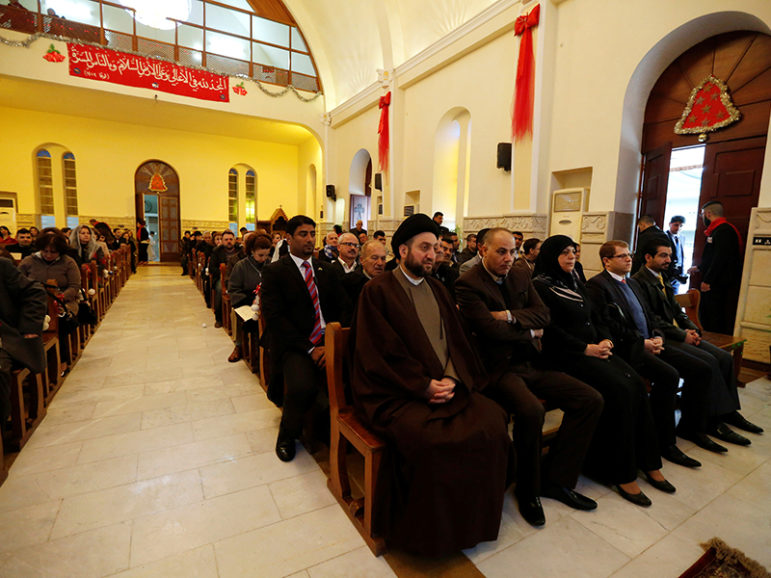 Ammar al-Hakim, leader of the Islamic Supreme Council of Iraq (ISCI), (C) attends a mass on Christmas at Mar George Chaldean Church in Baghdad, December 25, 2016. Courtesy of REUTERS/Ahmed Saad