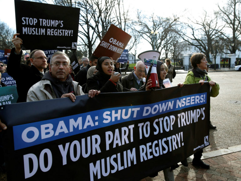 Members of Join MoveOn and DRUM march past the White House during a protest to shut down the existing Muslim registry program NSEERS in Washington, D.C., on Dec. 12, 2016. Photo courtesy of Reuters/Gary Cameron