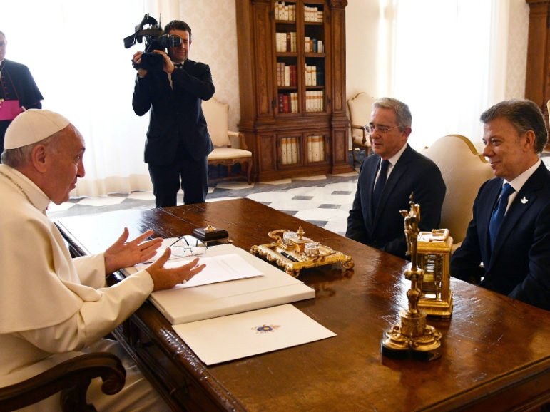 Pope Francis meets Colombia's President Juan Manuel Santos, on the right, and former president Alvaro Uribe, center, at the Vatican December 16, 2016. Photo via Reuters. 