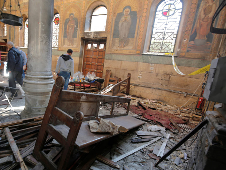 Egyptian security officials and investigators inspect the scene following a bombing inside Cairo's Coptic cathedral in Egypt on Dec. 11, 2016. Photo courtesy of Reuters/Amr Abdallah Dalsh 