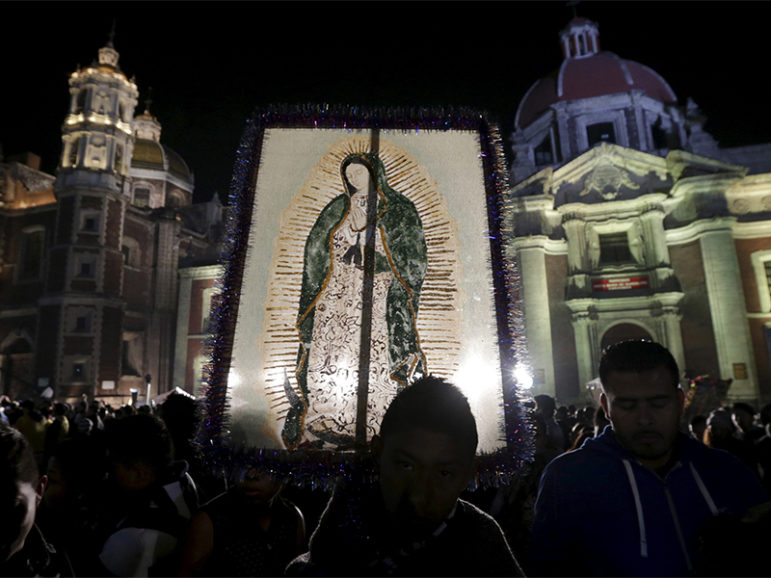 A pilgrim holds up an image of the Virgin of Guadalupe at the Basilica of Guadalupe during an annual pilgrimage in honor of the Virgin, the patron saint of Mexican Catholics, in Mexico City on Dec. 12, 2015. Photo courtesy of Reuters/Henry Romero
*Editors: This photo may only be republished with RNS-CHESNUT-OPED, originally published on Dec. 9, 2016.