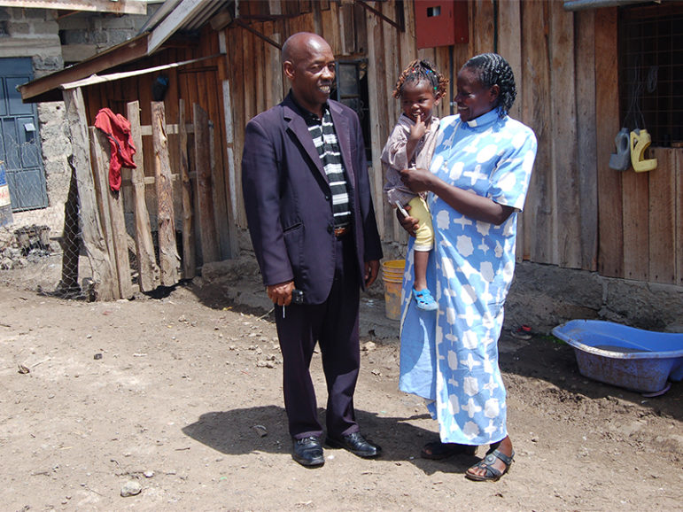 The Rev. Rahab Wanjiru, right, with her husband, Mathew Muhoro, and their daughter, Joywin Wangari, outside of their home in the Lamuria district center in Kenya on Nov. 26, 2016. RNS photo by Fredrick Nzwili
