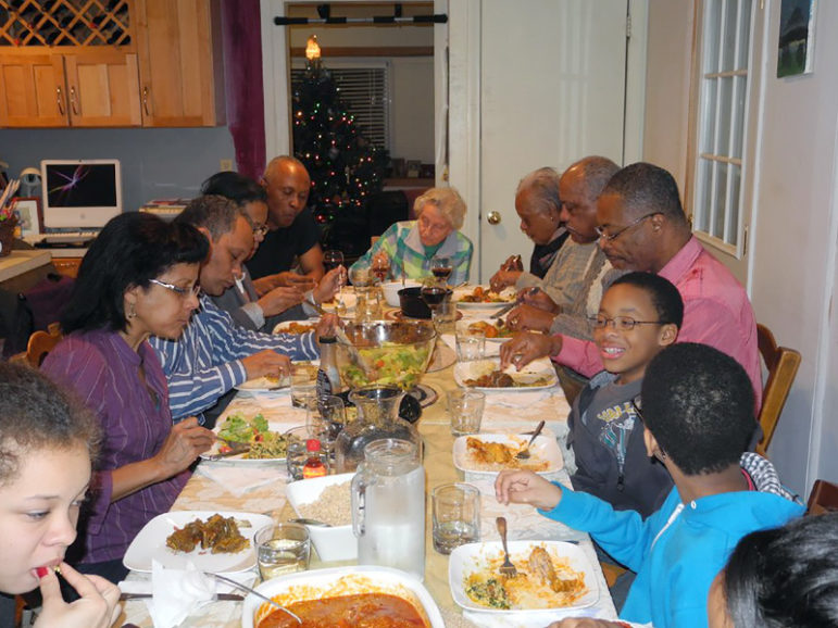 Okey Ndibe’s family gathers for a traditional Nigerian Christmas meal. Photo courtesy of Okey Ndibe