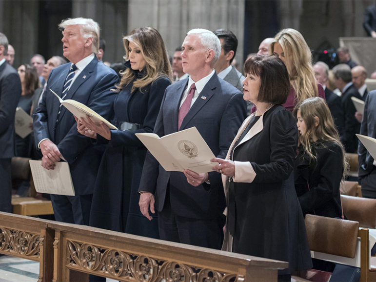 U.S. President Donald Trump sings while accompanied by his wife, Melania, Vice President Mike Pence and his wife, Karen, during a prayer service at Washington National Cathedral the morning after his inauguration, in Washington, D.C., on Jan. 21, 2017. Photo courtesy of Washington National Cathedral/Danielle E. Thomas