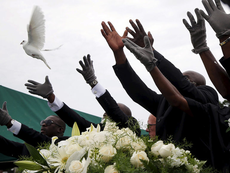Pall bearers release white doves over the casket of Ethel Lance as she is buried at the Emanuel African Methodist Episcopal Church cemetery in North Charleston, South Carolina on June 25, 2015.  Lance is one of the nine victims of the mass shooting at the Emanuel African Methodist Episcopal Church. Photo courtesy of REUTERS/Brian Snyder
*Editors: This photo may only be republished with RNS-FAITH-FORGIVE, originally transmitted on June 25, 2015.